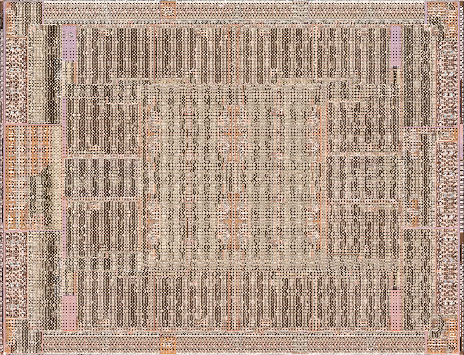 Macro photograph of an integrated circuit die with top-metal layers visible